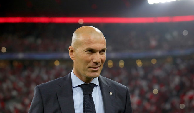 Zinédine Zidane MUNICH, GERMANY - APRIL 25: Zinedine Zidane, head coach of Real Madrid loosk on prior to the UEFA Champions League Semi Final First Leg match between Bayern Muenchen and Real Madrid at the Allianz Arena on April 25, 2018 in Munich, Germany. (Photo by Alexander Hassenstein/Bongarts/Getty Images)