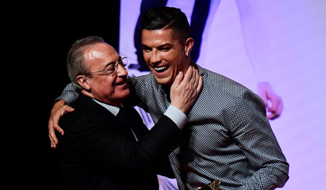 Portugal and Juventus forward Cristiano Ronaldo is congratulated by his former club Real Madrid's president Florentino Perez (L) after receiving the MARCA Leyenda (MARCA Legend) award in Madrid on July 29, 2019. - The award is attributed to sport professionals by the Spanish sports newspaper MARCA. (Photo by JAVIER SORIANO / AFP) (Photo credit should read JAVIER SORIANO/AFP/Getty Images)