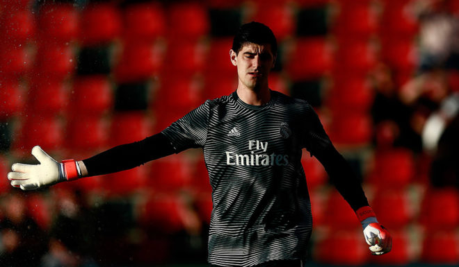 Real Madrid's Belgian goalkeeper Thibaut Courtois warms up before the Spanish League football match between Rayo Vallecano and Real Madrid at the Vallecas Stadium in the Madrid district of Puente de Vallecas on April 28, 2019. (Photo by Benjamin CREMEL / AFP) (Photo credit should read BENJAMIN CREMEL/AFP/Getty Images)