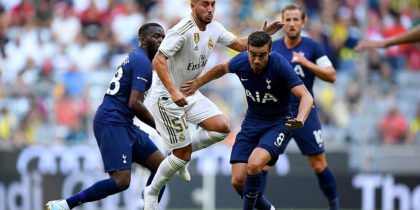 MUNICH, GERMANY - JULY 30: Eden Hazard (L) of Madrid challenges Harry Billy Winks #8 of Tottenham during the Audi Cup 2019 semi final match between Real Madrid and Tottenham Hotspur at Allianz Arena on July 30, 2019 in Munich, Germany. (Photo by Matthias Hangst/Bongarts/Getty Images)