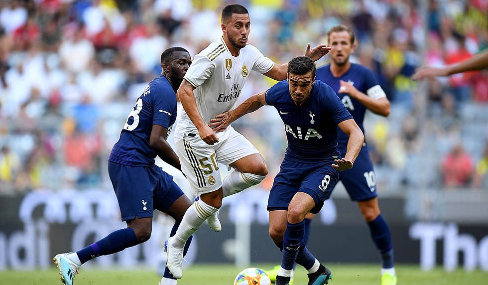 MUNICH, GERMANY - JULY 30: Eden Hazard (L) of Madrid challenges Harry Billy Winks #8 of Tottenham during the Audi Cup 2019 semi final match between Real Madrid and Tottenham Hotspur at Allianz Arena on July 30, 2019 in Munich, Germany. (Photo by Matthias Hangst/Bongarts/Getty Images)