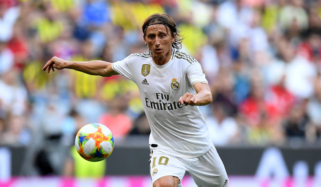 MUNICH, GERMANY - JULY 30: Luca Modric of Madrid runs with the ball during the Audi Cup 2019 semi final match between Real Madrid and Tottenham Hotspur at Allianz Arena on July 30, 2019 in Munich, Germany. (Photo by Matthias Hangst/Bongarts/Getty Images)