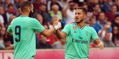 Real Madrid's forward Eden Hazard celebrates scoring with his team-mate Real Madrid's French forward Karim Benzema (L) during the pre-Season friendly football match FC Red Bull Salzburg v Real Madrid in Salzburg, Austria on August 7, 2019. (Photo by KRUGFOTO / APA / AFP) / Austria OUT (Photo credit should read KRUGFOTO/AFP/Getty Images)