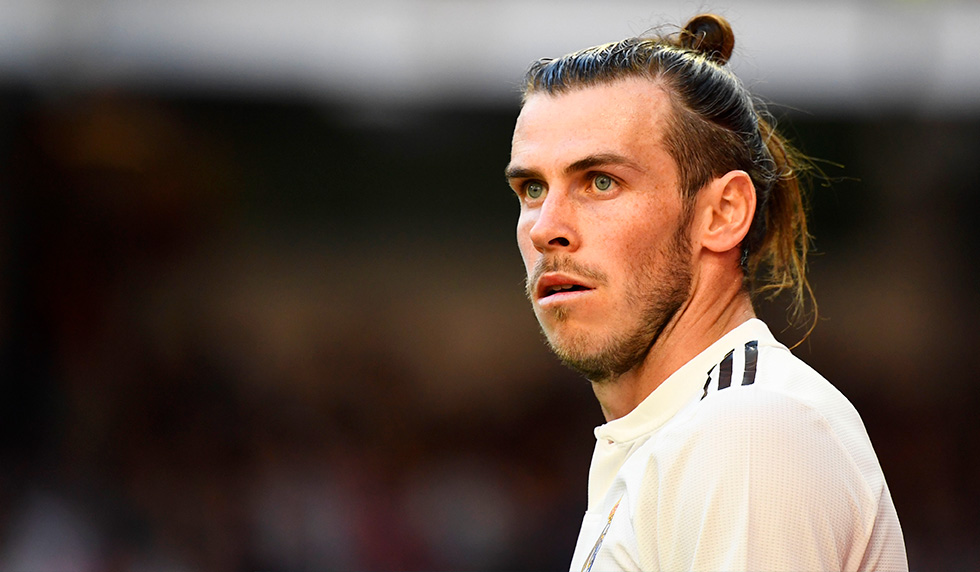 Real Madrid's Welsh forward Gareth Bale looks at the referee after being handed a yellow card during the Spanish league football match between Real Madrid CF and RC Celta de Vigo at the Santiago Bernabeu stadium in Madrid on March 16, 2019. (Photo by GABRIEL BOUYS / AFP) (Photo credit should read GABRIEL BOUYS/AFP/Getty Images)