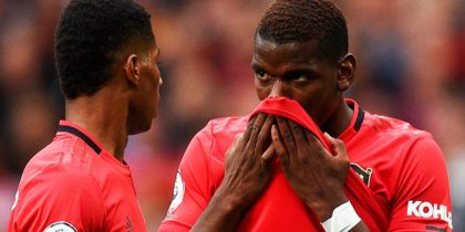 Manchester United's English striker Marcus Rashford (L) and Manchester United's French midfielder Paul Pogba (R) talk before Rashford takes a penalty and scores the opening goal during the English Premier League football match between Manchester United and Chelsea at Old Trafford in Manchester, north west England, on August 11, 2019. (Photo by Oli SCARFF / AFP) / RESTRICTED TO EDITORIAL USE. No use with unauthorized audio, video, data, fixture lists, club/league logos or 'live' services. Online in-match use limited to 120 images. An additional 40 images may be used in extra time. No video emulation. Social media in-match use limited to 120 images. An additional 40 images may be used in extra time. No use in betting publications, games or single club/league/player publications. / (Photo credit should read OLI SCARFF/AFP/Getty Images)