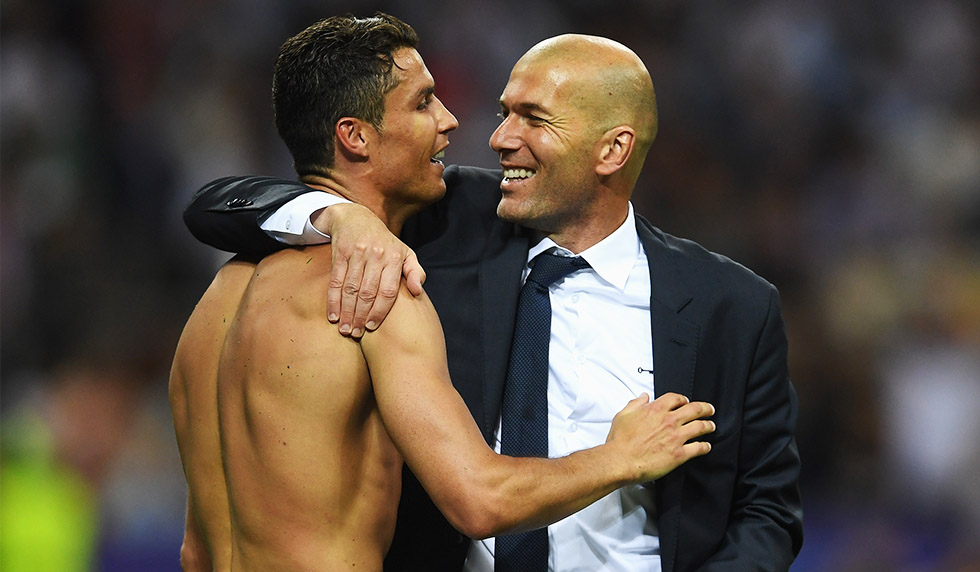 MILAN, ITALY - MAY 28: Cristiano Ronaldo of Real Madrid celebrates with head coach Zinedine Zidane after victory in the UEFA Champions League Final match between Real Madrid and Club Atletico de Madrid at Stadio Giuseppe Meazza on May 28, 2016 in Milan, Italy. (Photo by Laurence Griffiths/Getty Images)