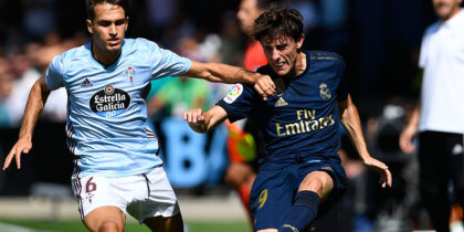 VIGO, SPAIN - AUGUST 17: Denis Suarez of RC Celta competes for the ball with Alvaro Odriozola of Real Madrid during the Liga match between RC Celta de Vigo and Real Madrid CF at Abanca-Balaídos on August 17, 2019 in Vigo, Spain. (Photo by Octavio Passos/Getty Images)