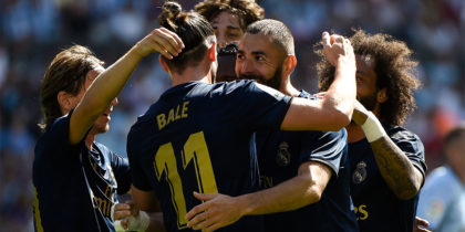 Real Madrid's French forward Karim Benzema (C) celebrates with teammates after scoring a goal during the Spanish League football match between Celta Vigo and Real Madrid at the Balaidos Stadium in Vigo on August 17, 2019. (Photo by MIGUEL RIOPA / AFP) (Photo credit should read MIGUEL RIOPA/AFP/Getty Images)