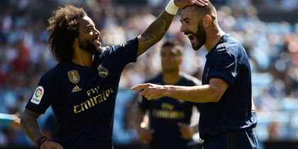 Real Madrid's French forward Karim Benzema (R) celebrates with Real Madrid's Brazilian defender Marcelo after scoring a goal during the Spanish League football match between Celta Vigo and Real Madrid at the Balaidos Stadium in Vigo on August 17, 2019. (Photo by MIGUEL RIOPA / AFP) (Photo credit should read MIGUEL RIOPA/AFP/Getty Images)