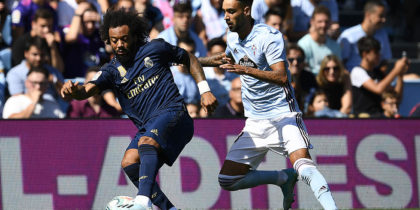 VIGO, SPAIN - AUGUST 17: Brais Mendez of RC Celta competes for the ball with Marcelo of Real Madrid during the Liga match between RC Celta de Vigo and Real Madrid CF at Abanca-Balaídos on August 17, 2019 in Vigo, Spain. (Photo by Octavio Passos/Getty Images)