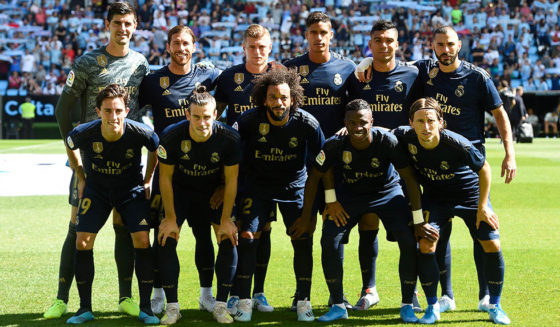 (Back L-R) Real Madrid's Belgian goalkeeper Thibaut Courtois, Real Madrid's Spanish defender Sergio Ramos, Real Madrid's German midfielder Toni Kroos, Real Madrid's French defender Raphael Varane, Real Madrid's Brazilian midfielder Casemiro, Real Madrid's French forward Karim Benzema, (L-R) Real Madrid's Spanish defender Alvaro Odriozola, Real Madrid's Welsh forward Gareth Bale, Real Madrid's Brazilian defender Marcelo, Real Madrid's Brazilian forward Vinicius Junior and Real Madrid's Croatian midfielder Luka Modric pose for a group picture before the Spanish League football match between Celta Vigo and Real Madrid at the Balaidos Stadium in Vigo on August 17, 2019. (Photo by MIGUEL RIOPA / AFP) (Photo credit should read MIGUEL RIOPA/AFP/Getty Images)