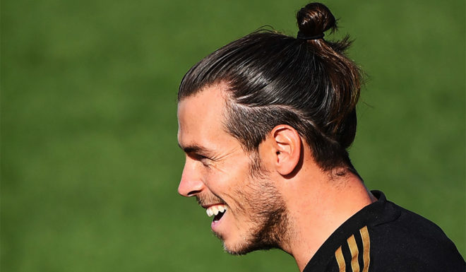 Real Madrid's Welsh forward Gareth Bale laughs during a training session at the Ciudad Real Madrid training ground in Valdebebas near Madrid on August 23, 2019 ahead of their Spanish League football match against Real Valladolid. (Photo by GABRIEL BOUYS / AFP) (Photo credit should read GABRIEL BOUYS/AFP/Getty Images)