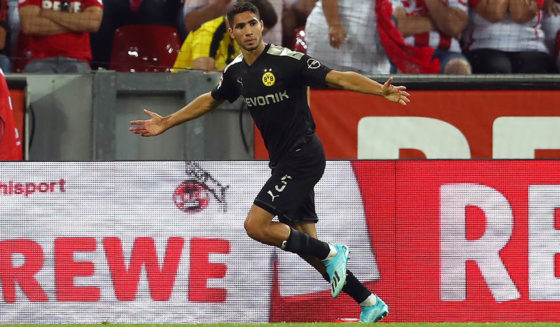 Achraf Hakimi COLOGNE, GERMANY - AUGUST 23: Achraf Hakimi of Borussia Dortmund celebrates after scoring his side's second goal during the Bundesliga match between 1. FC Koeln and Borussia Dortmund at RheinEnergieStadion on August 23, 2019 in Cologne, Germany. (Photo by Lars Baron/Bongarts/Getty Images)
