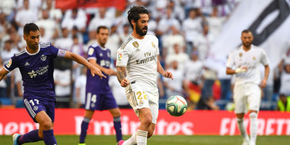 Valladolid's Spanish defender Javi Moyano (L) challenges Real Madrid's Spanish midfielder Isco (C) during the Spanish League football match between Real Madrid and Real Valladolid at the Santiago Bernabeu stadium in Madrid on August 24, 2019. (Photo by GABRIEL BOUYS / AFP) (Photo credit should read GABRIEL BOUYS/AFP/Getty Images)