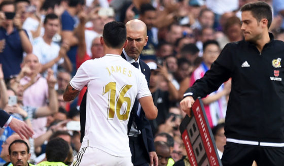 MADRID, SPAIN - AUGUST 24: James Rodriguez of Real Madrid has a word with Zinedine Zidane, Manager of Real Madrid after being substituted during the La Liga match between Real Madrid CF and Real Valladolid CF at Estadio Santiago Bernabeu on August 24, 2019 in Madrid, Spain. (Photo by Denis Doyle/Getty Images)