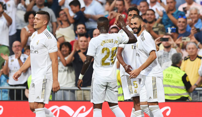 Real Madrid MADRID, SPAIN - AUGUST 24: Karim Benzema of Real Madrid(R) celebrates after scoring his sides first goal during the La Liga match between Real Madrid CF and Real Valladolid CF at Estadio Santiago Bernabeu on August 24, 2019 in Madrid, Spain. (Photo by Denis Doyle/Getty Images)