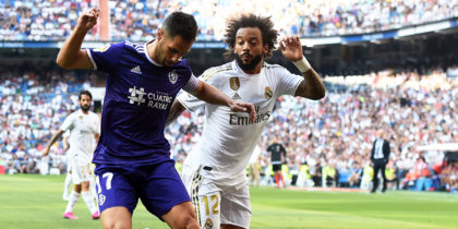 MADRID, SPAIN - AUGUST 24: Javi Moyano of Real Valladolid is tackled by Marcelo of Real Madrid during the La Liga match between Real Madrid CF and Real Valladolid CF at Estadio Santiago Bernabeu on August 24, 2019 in Madrid, Spain. (Photo by Denis Doyle/Getty Images)