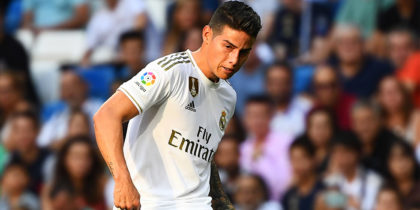 Valladolid's Spanish midfielder Fede San Emeterio (l) CHALLENGES Real Madrid's Colombian midfielder James Rodriguez during the Spanish League football match between Real Madrid and Real Valladolid at the Santiago Bernabeu stadium in Madrid on August 24, 2019. (Photo by GABRIEL BOUYS / AFP) (Photo credit should read GABRIEL BOUYS/AFP/Getty Images)