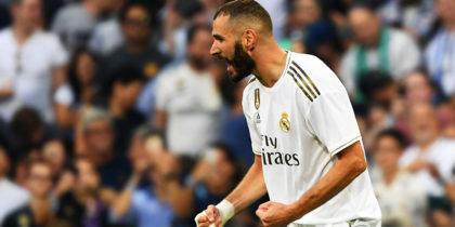 Real Madrid's French forward Karim Benzema (C) celebrates after scoring during the Spanish League football match between Real Madrid and Real Valladolid at the Santiago Bernabeu stadium in Madrid on August 24, 2019. (Photo by GABRIEL BOUYS / AFP) (Photo credit should read GABRIEL BOUYS/AFP/Getty Images)