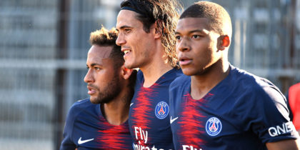 Paris Saint-Germain's French forward Kylian Mbappe (R) celebrates with Paris Saint-Germain's Uruguayan forward Edinson Cavani (C) and Paris Saint-Germain's Brazilian forward Neymar Jr (L) after scoring their third goal during the French L1 football match between Nimes and Paris Saint-Germain (PSG), on September 1, 2018 at the Costieres stadium in Nimes, southern France. (Photo by PASCAL GUYOT / AFP) (Photo credit should read PASCAL GUYOT/AFP/Getty Images)