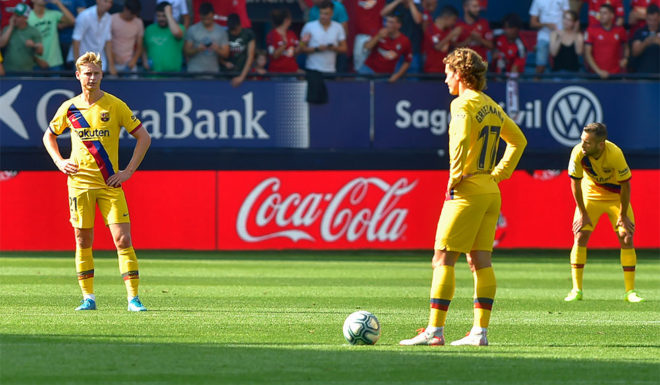 (FromL) Barcelona's Dutch midfielder Frenkie De Jong, Barcelona's French forward Antoine Griezmann and Barcelona's Spanish defender Jordi Alba react after Osasuna's Spanish midfielder Roberto Torres scored a goal during the Spanish league football match CA Osasuna against FC Barcelona at El Sadar stadium in Pamplona on August 31, on 2019. (Photo by ANDER GILLENEA / AFP) (Photo credit should read ANDER GILLENEA/AFP/Getty Images)