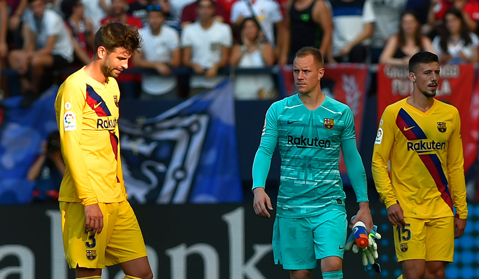 Barcelona's Spanish defender Gerard Pique (C) reacts after the Spanish league football match CA Osasuna against FC Barcelona at El Sadar stadium in Pamplona on August 31, on 2019. (Photo by ANDER GILLENEA / AFP) (Photo credit should read ANDER GILLENEA/AFP/Getty Images)