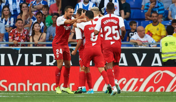BARCELONA, SPAIN - AUGUST 18: Sevilla FC players celebrate with their teammate Sergio Reguilon after scoring the opening goal during the Liga match between RCD Espanyol and Sevilla FC at RCDE Stadium on August 18, 2019 in Barcelona, Spain. (Photo by Alex Caparros/Getty Images)