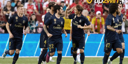 Real Madrid's Spanish midfielder Isco (2L) celebrates the opening goal with teammates during the UEFA Champions League group G football match between Real Madrid CF and AS Roma at the Santiago Bernabeu stadium in Madrid on September 19, 2018. (Photo by OSCAR DEL POZO / AFP) (Photo credit should read OSCAR DEL POZO/AFP/Getty Images)