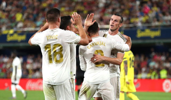 VILLAREAL, SPAIN - SEPTEMBER 01: Gareth Bale of Real Madrid celebrates with team mates after scoring his sides first goal during the Liga match between Villarreal CF and Real Madrid CF at Estadio de la Ceramica on September 01, 2019 in Villareal, Spain. (Photo by David Ramos/Getty Images)