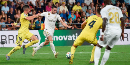 Real Madrid's Welsh forward Gareth Bale (2L) scores a goal during the Spanish league football match Villarreal CF against Real Madrid CF at La Ceramica stadium in Vila-real on September 1, 2019. (Photo by Josep LAGO / AFP) (Photo credit should read JOSEP LAGO/AFP/Getty Images)