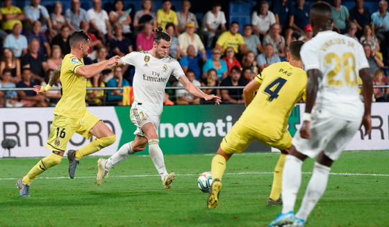 Real Madrid's Welsh forward Gareth Bale (2L) scores a goal during the Spanish league football match Villarreal CF against Real Madrid CF at La Ceramica stadium in Vila-real on September 1, 2019. (Photo by Josep LAGO / AFP) (Photo credit should read JOSEP LAGO/AFP/Getty Images)