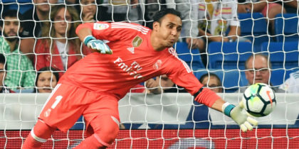 Real Betis' forward from Paraguay Arnaldo Sanabria (L) heads the ball in front of Real Madrid's goalkeeper from Costa Rica Keylor Navas, to score a goal during the Spanish league football match Real Madrid CF against Real Betis at the Santiago Bernabeu stadium in Madrid on September 20, 2017. (Photo by GABRIEL BOUYS / AFP) (Photo credit should read GABRIEL BOUYS/AFP/Getty Images)