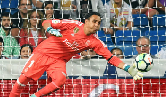 Real Betis' forward from Paraguay Arnaldo Sanabria (L) heads the ball in front of Real Madrid's goalkeeper from Costa Rica Keylor Navas, to score a goal during the Spanish league football match Real Madrid CF against Real Betis at the Santiago Bernabeu stadium in Madrid on September 20, 2017. (Photo by GABRIEL BOUYS / AFP) (Photo credit should read GABRIEL BOUYS/AFP/Getty Images)