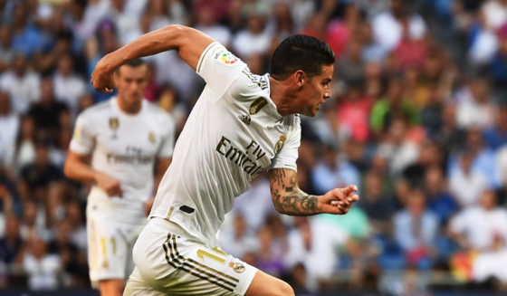 Real Madrid's Colombian midfielder James Rodriguez (L) challenges Valladolid's Spanish midfielder Oscar Plano (R) during the Spanish League football match between Real Madrid and Real Valladolid at the Santiago Bernabeu stadium in Madrid on August 24, 2019. (Photo by GABRIEL BOUYS / AFP) (Photo credit should read GABRIEL BOUYS/AFP/Getty Images)