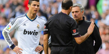 Real Madrid's Portuguese forward Cristiano Ronaldo and Real Madrid's Portuguese coach Jose Mourinho argue with the referee during the Spanish league football match Real Madrid CF vs Real Betis at the Santiago Bernabeu stadium in Madrid on April 20, 2013. AFP PHOTO / DANI POZO (Photo credit should read DANI POZO/AFP/Getty Images)