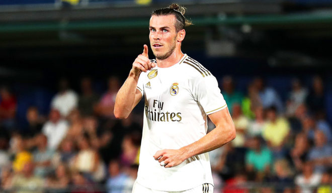 Gareth Bale VILLAREAL, SPAIN - SEPTEMBER 01: Gareth Bale of Real Madrid celebrates after scoring his sides first goal during the Liga match between Villarreal CF and Real Madrid CF at Estadio de la Ceramica on September 01, 2019 in Villareal, Spain. (Photo by David Ramos/Getty Images)