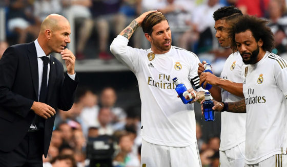 Real Madrid's French coach Zinedine Zidane (L) talks to Real Madrid's Spanish defender Sergio Ramos, Real Madrid's Brazilian midfielder Casemiro and Real Madrid's Brazilian defender Marcelo during the Spanish League football match between Real Madrid and Real Valladolid at the Santiago Bernabeu stadium in Madrid on August 24, 2019. (Photo by GABRIEL BOUYS / AFP) (Photo credit should read GABRIEL BOUYS/AFP/Getty Images)