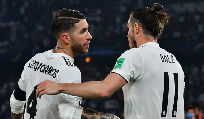 Real Madrid's Spanish defender Sergio Ramos (L) congratulates Real Madrid's Welsh forward Gareth Bale (R) for his goal during the semi final football match of the FIFA Club World Cup 2018 tournament between Japan's Kashima Antlers and Spain's Real Madrid at the Zayed Sports City Stadium in Abu Dhabi, the capital of the United Arab Emirates, on December 19, 2018. (Photo by Giuseppe CACACE / AFP) (Photo credit should read GIUSEPPE CACACE/AFP/Getty Images)