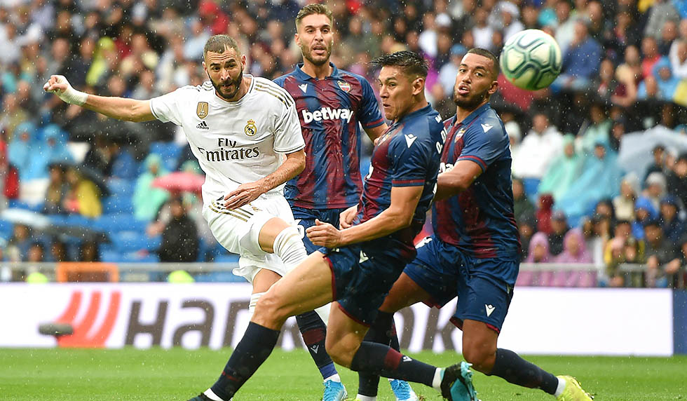 MADRID, SPAIN - SEPTEMBER 14: Karim Benzema of Real Madrid shoots on goal during the La Liga match between Real Madrid CF and Levante UD at Estadio Santiago Bernabeu on September 14, 2019 in Madrid, Spain. (Photo by Denis Doyle/Getty Images)