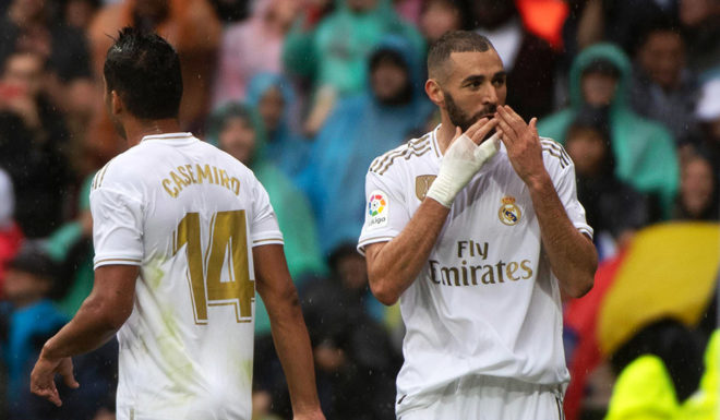 Real Madrid's French forward Karim Benzema celebrates after scoring during the Spanish league football match Real Madrid CF against Levante UD at the Santiago Bernabeu stadium in Madrid on September 14, 2019. (Photo by CURTO DE LA TORRE / AFP) (Photo credit should read CURTO DE LA TORRE/AFP/Getty Images)