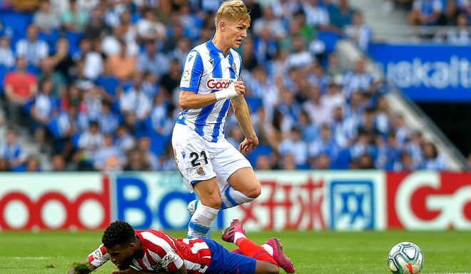 Real Sociedad's Norwegian midfielder Martin Odegaard (R) vies with Atletico Madrid's French midfielder Thomas Lemar during the Spanish league football match Real Sociedad against Club Atletico de Madrid at The Anoeta Stadium in San Sebastian on September 14, 2019. (Photo by ANDER GILLENEA / AFP) (Photo credit should read ANDER GILLENEA/AFP/Getty Images)