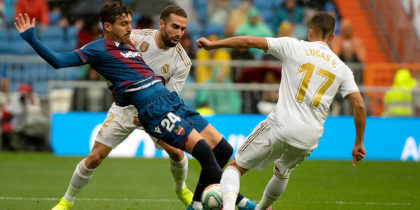 Levante's Spanish midfielder Jose Campana (L) vies with Real Madrid's Spanish forward Lucas Vazquez (R) and Real Madrid's Spanish midfielder Isco during the Spanish league football match Real Madrid CF against Levante UD at the Santiago Bernabeu stadium in Madrid on September 14, 2019. (Photo by CURTO DE LA TORRE / AFP) (Photo credit should read CURTO DE LA TORRE/AFP/Getty Images)