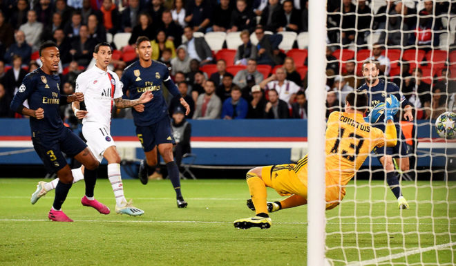 Paris Saint-Germain's Argentine midfielder Angel Di Maria scores his team's first goal during the UEFA Champions league Group A football match between Paris Saint-Germain and Real Madrid, at the Parc des Princes stadium, in Paris, on September 18, 2019. (Photo by Lucas BARIOULET / AFP) (Photo credit should read LUCAS BARIOULET/AFP/Getty Images)