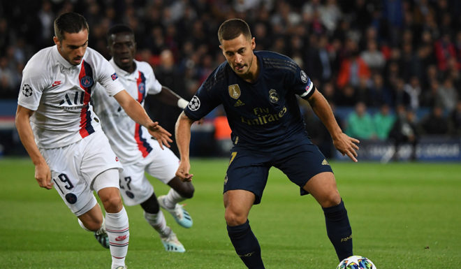 Real Madrid's Belgian forward Eden Hazard (R) fights for the ball with Paris Saint-Germain's Spanish midfielder Pablo Sarabia during the UEFA Champions league Group A football match between Paris Saint-Germain and Real Madrid, at the Parc des Princes stadium, in Paris, on September 18, 2019. (Photo by MARTIN BUREAU / AFP) (Photo credit should read MARTIN BUREAU/AFP/Getty Images)