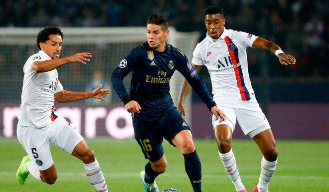 Real Madrid's Colombian midfielder James Rodriguez (C) controls the ball during the UEFA Champions league Group A football match between Paris Saint-Germain and Real Madrid, at the Parc des Princes stadium, in Paris, on September 18, 2019. (Photo by Thomas SAMSON / AFP) (Photo credit should read THOMAS SAMSON/AFP/Getty Images)