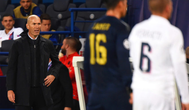 Zinedine Zidane Real Madrid's French coach Zinedine Zidane (L) reacts during the UEFA Champions league Group A football match between Paris Saint-Germain and Real Madrid, at the Parc des Princes stadium, in Paris, on September 18, 2019. (Photo by Lucas BARIOULET / AFP) (Photo credit should read LUCAS BARIOULET/AFP/Getty Images)