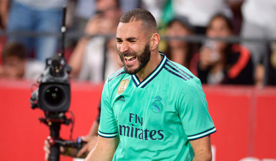 Real Madrid's French forward Karim Benzema celebrates after scoring a goal during the Spanish league football match between Sevilla FC and Real Madrid CF at the Ramon Sanchez Pizjuan stadium in Seville on September 22, 2019. (Photo by CRISTINA QUICLER / AFP) (Photo credit should read CRISTINA QUICLER/AFP/Getty Images)