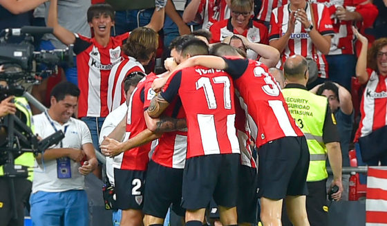 Athletic de Bilbao players celebrate Spanish forward Aritz Aduriz' goal during the Spanish league football match between Athletic Club Bilbao and FC Barcelona at the San Mames stadium in Bilbao on August 16, 2019. (Photo by ANDER GILLENEA / AFP) (Photo credit should read ANDER GILLENEA/AFP/Getty Images)