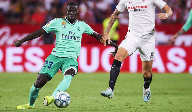 Ferland Mendy SEVILLE, SPAIN - SEPTEMBER 22: Ferland Mendy of Real Madrid CF duels for the ball with Lucas Ocampos of Sevilla FC during the Liga match between Sevilla FC and Real Madrid CF at Estadio Ramon Sanchez Pizjuan on September 22, 2019 in Seville, Spain. (Photo by Aitor Alcalde/Getty Images)