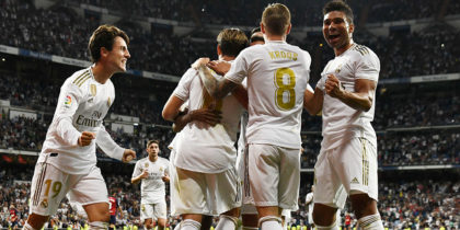 Real Madrid's Spanish defender Alvaro Odriozola (L) and Real Madrid's Brazilian midfielder Casemiro (R) celebrate with teammates their second goal scored by Real Madrid's Brazilian forward Rodrygo during the Spanish league football match between Real Madrid CF and CA Osasuna at the Santiago Bernabeu stadium in Madrid, on September 25, 2019. (Photo by OSCAR DEL POZO / AFP) (Photo credit should read OSCAR DEL POZO/AFP/Getty Images)